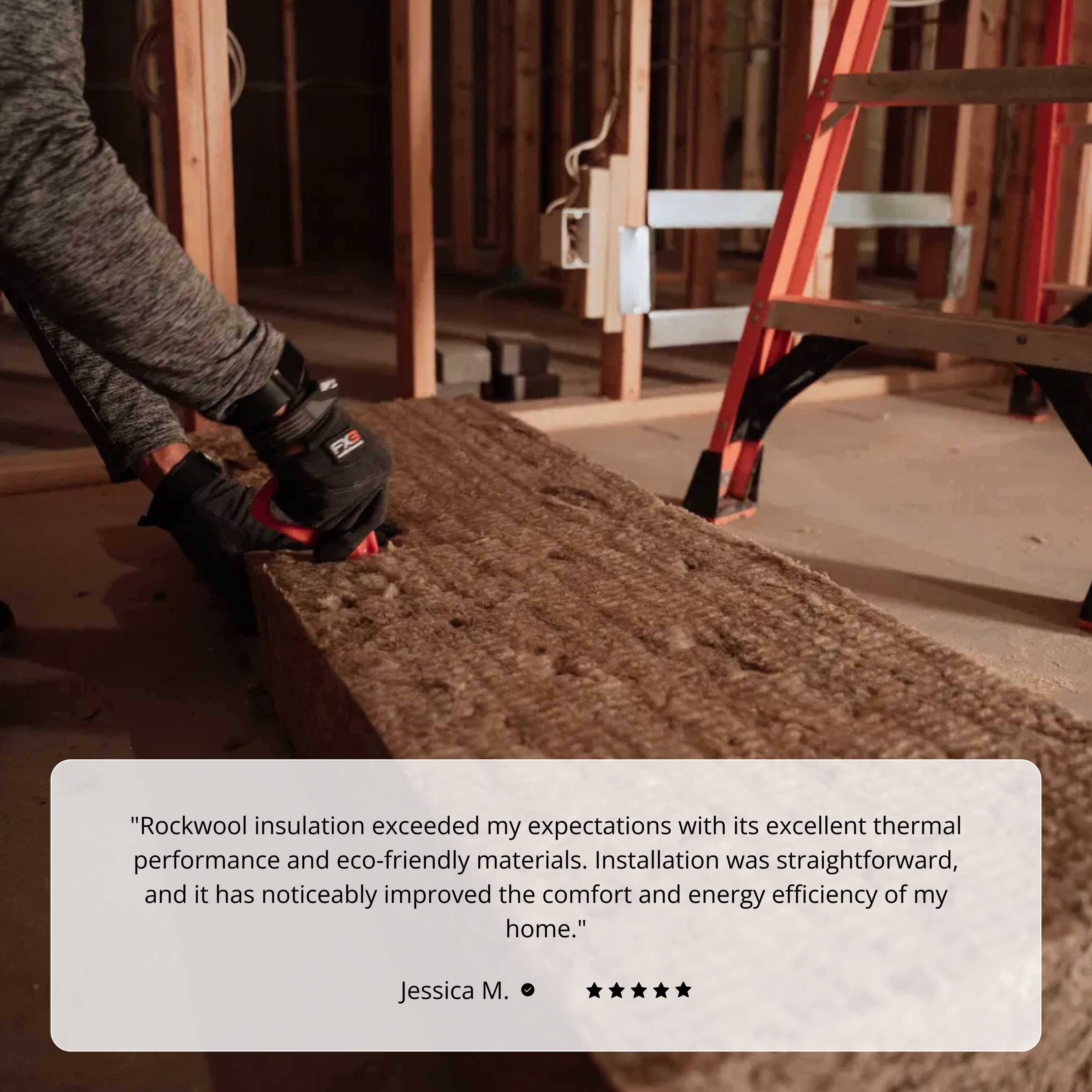 Wearing gloves, a person installs ROCKWOOL COMFORT BATT R30 7-1/4 in. X 23 in. X 47 in (30.03 SQFT) by Rockwool in a renovated room with exposed framing and a red ladder, while a testimonial praises its excellent thermal efficiency below.